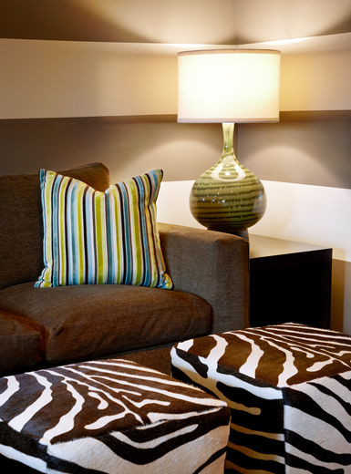 European interior designed lounge features microfiber sofa with custom ottomans: Newport Beach