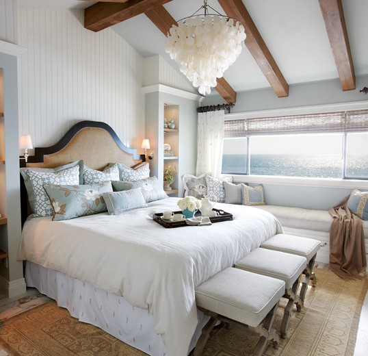 Subtle textures accompany a fabulous view in this master bedroom beachfront interior design: