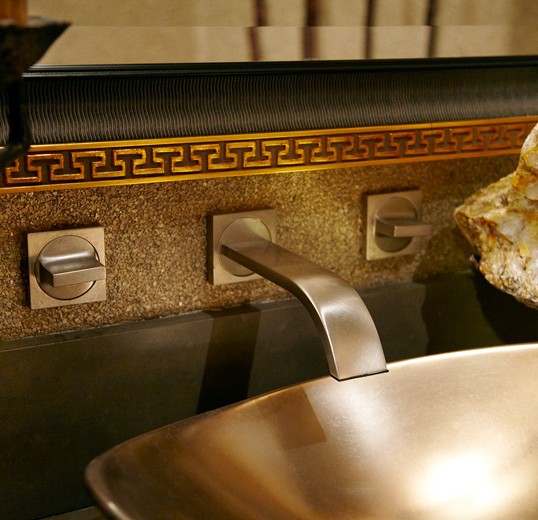 bespoke powder room sink hardware accentuates this functionally beautiful interior design